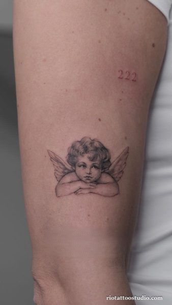 Small cherub angel tattoo with wings and 222 on inner arm, minimalist cute angel tattoo
