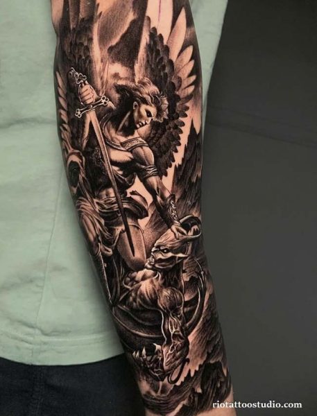 Archangel michael full sleeve tattoo defeating demon sword wings, epic religious tattoo