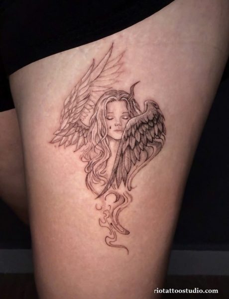 Elegant female angel tattoo with wings and flowing hair on thigh, artistic angel tattoo