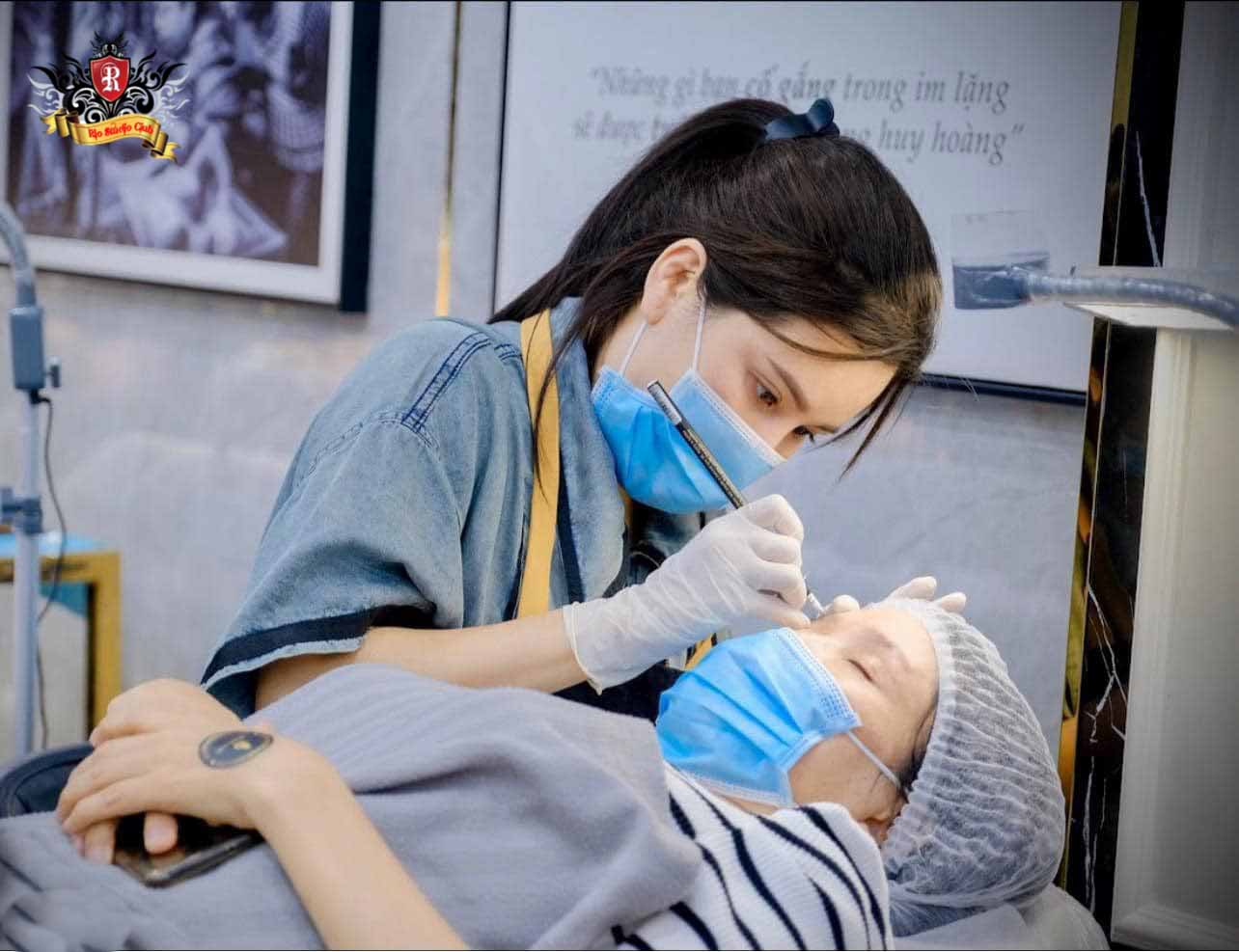 Artist Expert Tran Viet Ha, a renowned award-winning Tattoo and PMU Master, posing in his luxury studio.