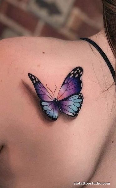 Single purple blue gradient butterfly with 3D shading on shoulder, modern butterfly tattoo