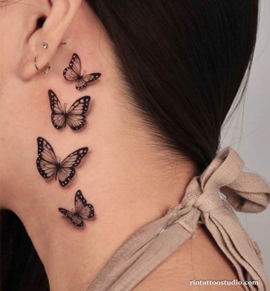 Four minimalist black butterflies in a vertical line on neck, elegant small butterfly tattoos