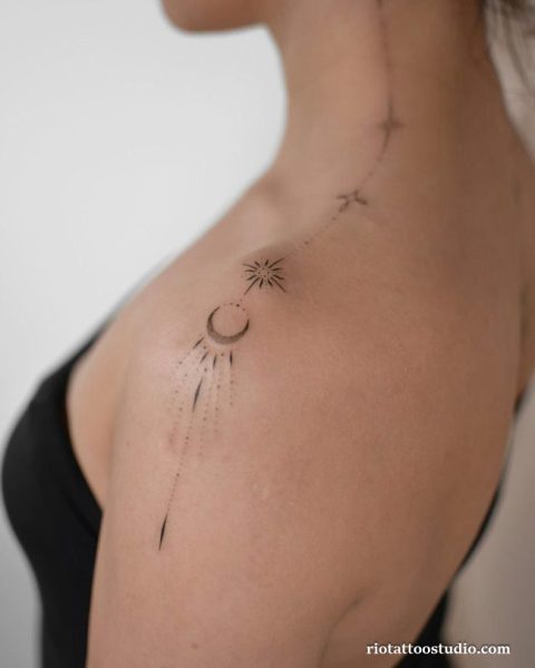 Fineline orchid flower curving stems on arm, elegant fineline tattoo