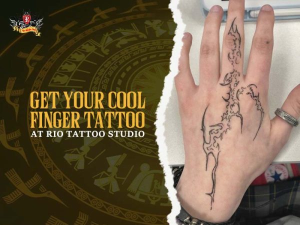Cool finger tattoo on hand – bold line work design at Rio Tattoo Studio