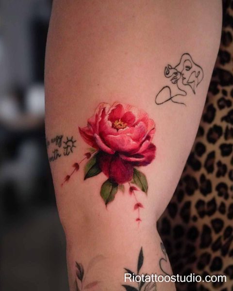 Red poppy flower with geisha line art on shoulder, artistic floral tattoo