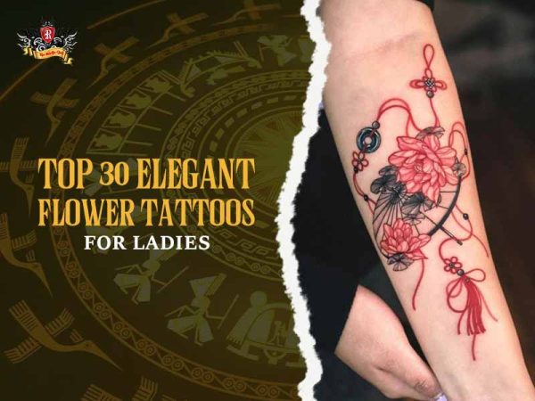 Elegant red lotus flower tattoo with tassel and ornamental details on forearm, feminine floral tattoo design for women