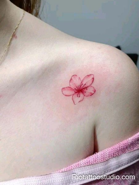 Single pink watercolor flower on shoulder, minimalist feminine flower tattoo