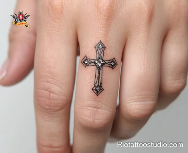 Realistic black and grey rosary cross tattoo on forearm featuring ornate cross wrapped with detailed prayer beads and small crucifix pendant, intricate shading for depth and spiritual symbolism