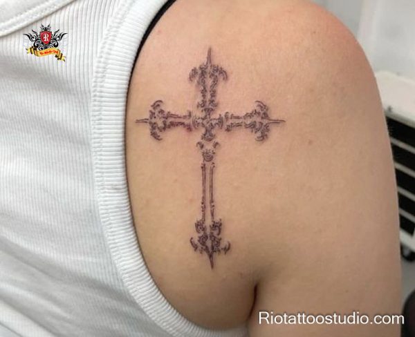 Ornamental cross tattoo with detailed gothic style – cross tattoos