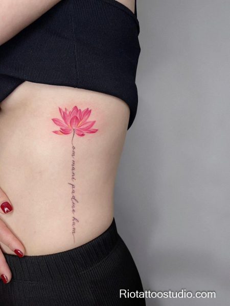 Small pink lotus flower tattoo with script on rib, delicate lotus flower tattoo