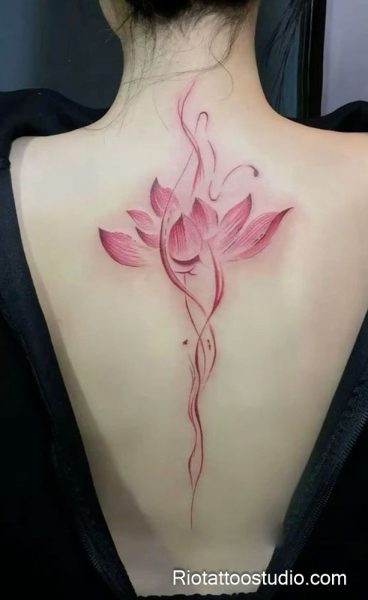 Pink lotus flower tattoo with flowing stem on upper back neck, elegant lotus tattoo