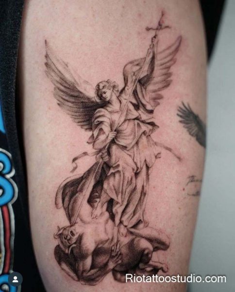 Michael archangel tattoo full figure with sword and halo on arm, detailed divine warrior tattoo