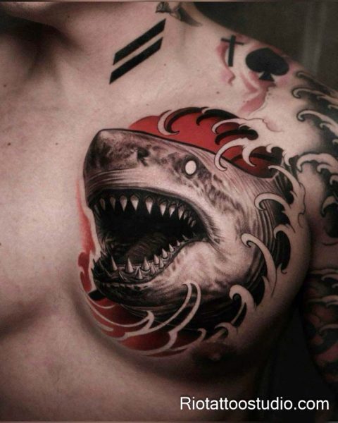 Traditional shark tattoo with red sun waves on chest, classic nautical shark tattoo
