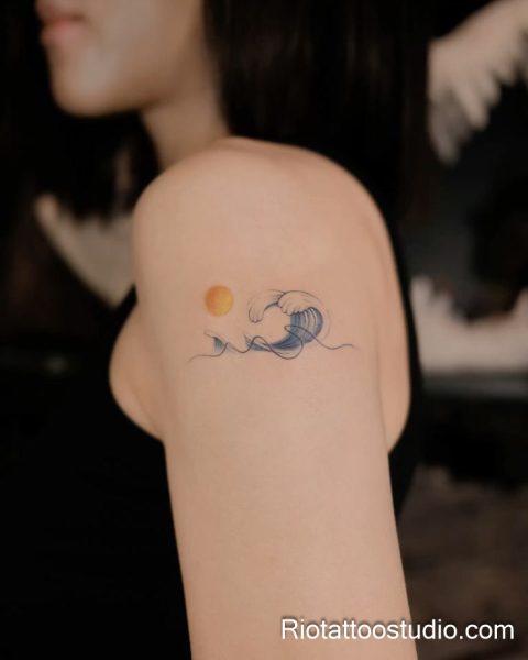 Smallest tattoos: nature-inspired sun wave design on shoulder, tiny minimalist tattoo