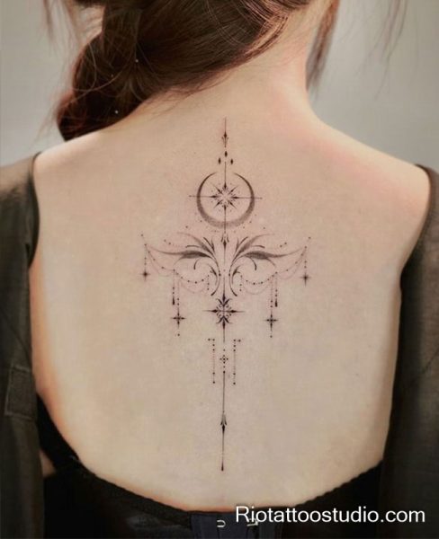 Smallest tattoos style: geometric moon and star mandala on upper back, feminine tattoo