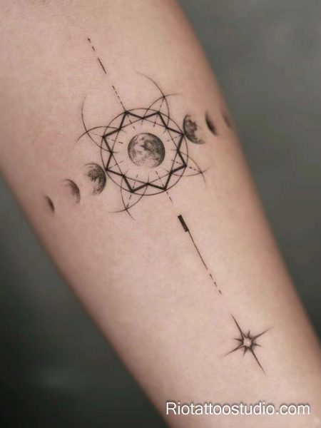 Smallest tattoos: geometric moon phases inside sacred circle on forearm, minimalist tattoo