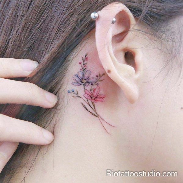 Smallest tattoos: tiny watercolor flowers behind the ear, feminine behind-the-ear tattoo