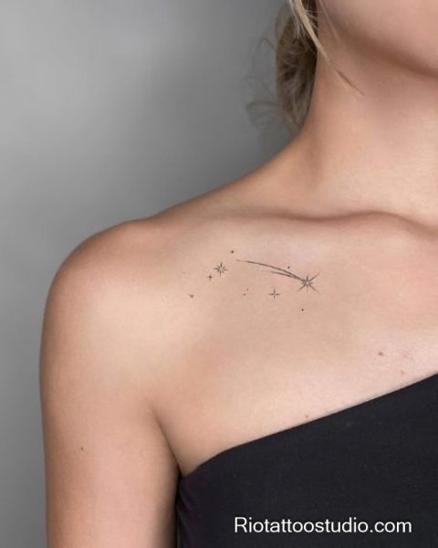 Minimal shooting star constellation tattoo on collarbone, delicate star tattoo design