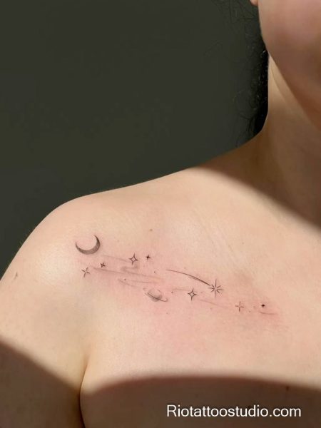 Celestial star tattoo with moon planets shooting star on chest, meaningful star tattoo