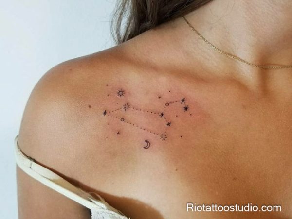 Wavy shooting star with moon and stars tattoo on forearm, artistic star tattoo