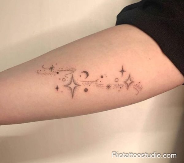 Minimal shooting star constellation tattoo on inner forearm, delicate star tattoo idea