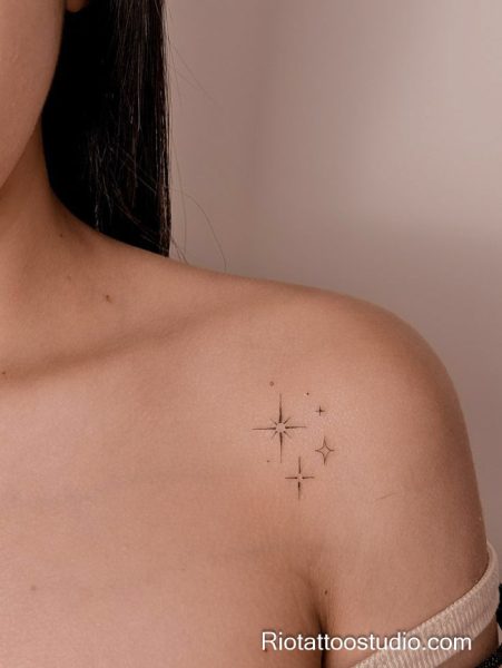 Minimal radiant star tattoo on shoulder, small geometric star tattoo