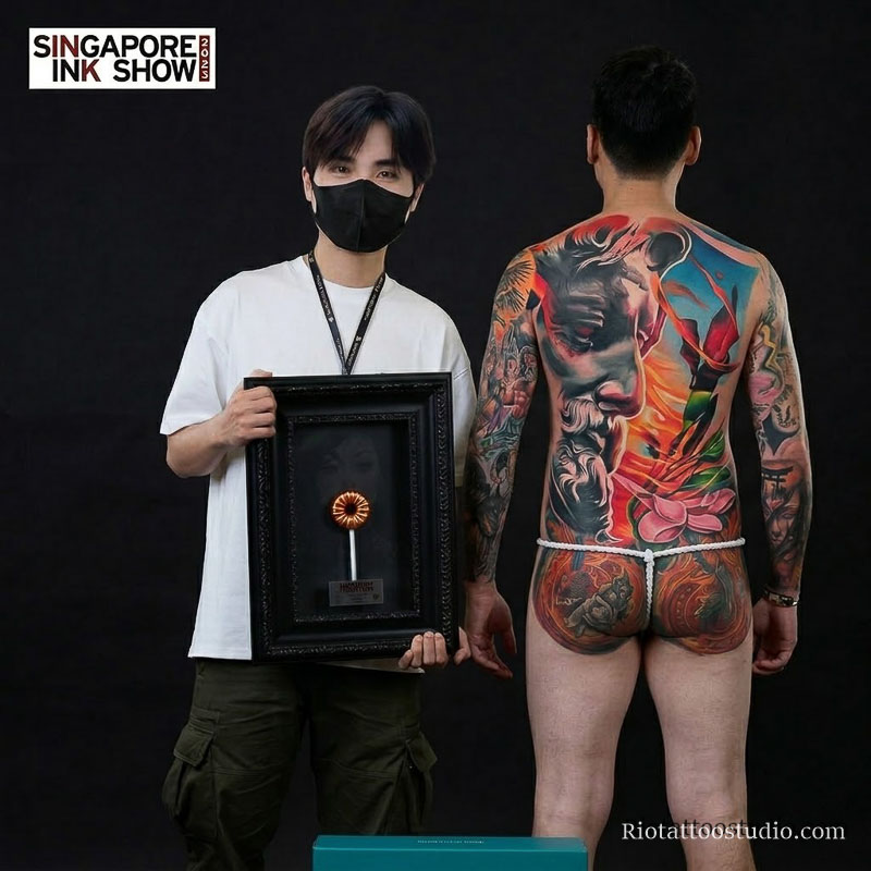 Tattoo Artist Anh Thang receiving recognition at the prestigious Singapore Ink Show tattoo competition