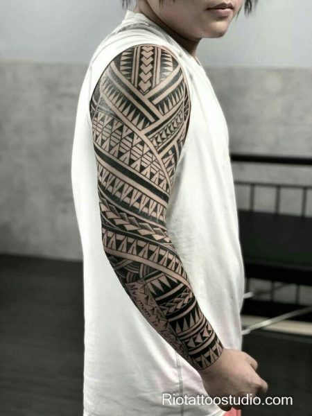 Polynesian tribal full sleeve arm tattoo braids motifs, youthful tribal arm tattoo