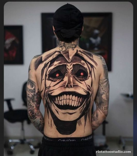 Berserk tattoo colorful Guts red eye beast of darkness forearm, intense berserk tattoo ideas