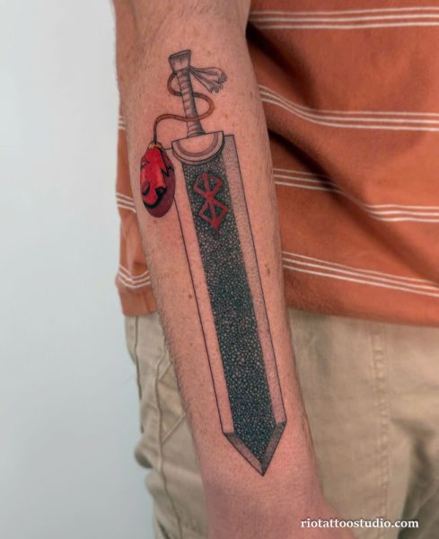 Berserk tattoo dragonslayer sword behelit forearm realistic, iconic berserk tattoo ideas