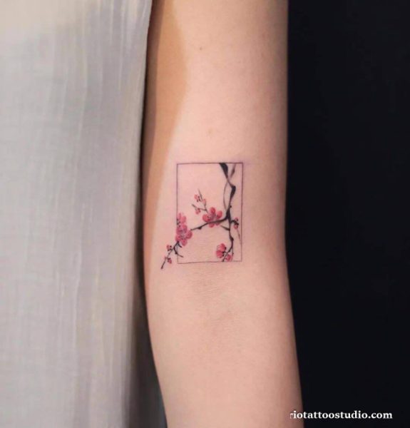 Cherry blossom branch forearm tattoo pink flowers buds petals, detailed cherry blossom tattoo