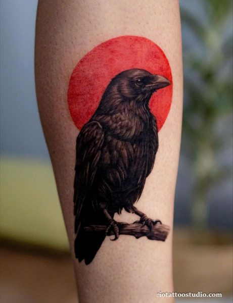 Realistic crow tattoo with red sun background on calf, Japanese inspired crow tattoo