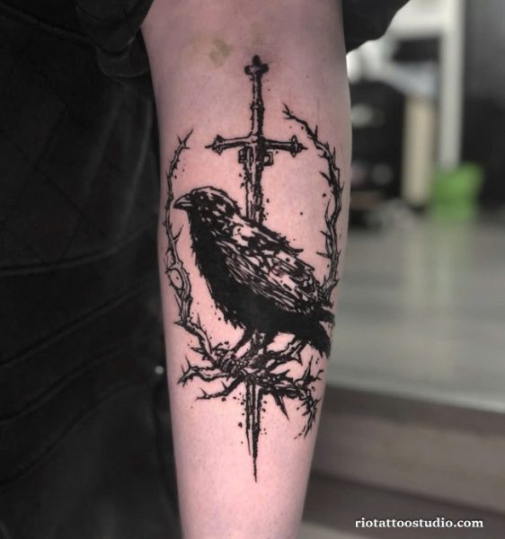 Crow tattoo with cross and thorns on forearm, gothic crow tattoo ideas