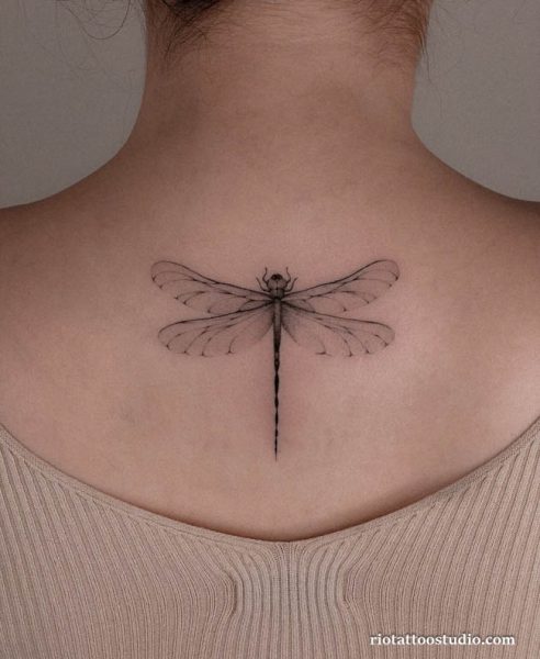 Minimalist fineline dragonfly tattoo neck back placement, delicate dragonfly tattoo