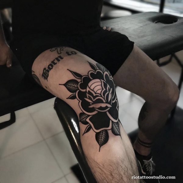 Knee tattoo black rose floral kneecap with born to script, elegant knee tattoo ideas