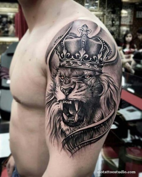 Crowned lion "In This Life" script forearm tattoo, motivational lion tattoo