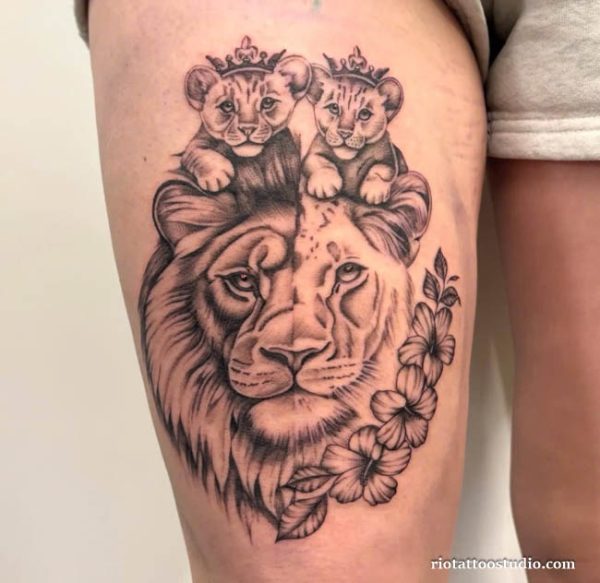 Lion with crowned cubs floral thigh tattoo realistic, family lion tattoo