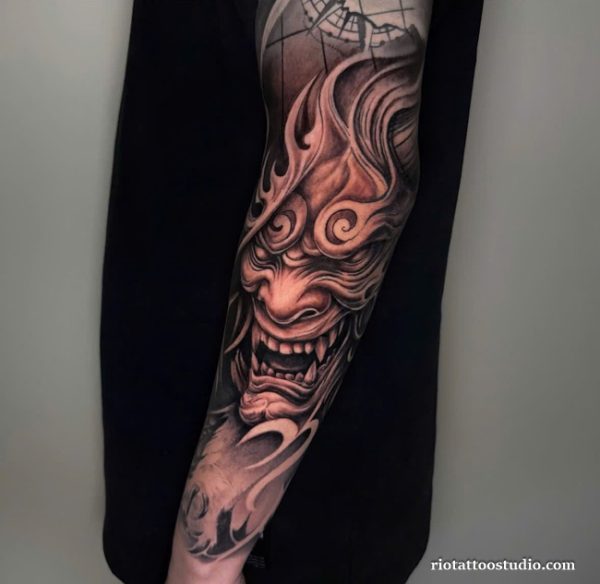 Oni mask tattoo black grey horns flame details thigh, powerful oni mask tattoo ideas