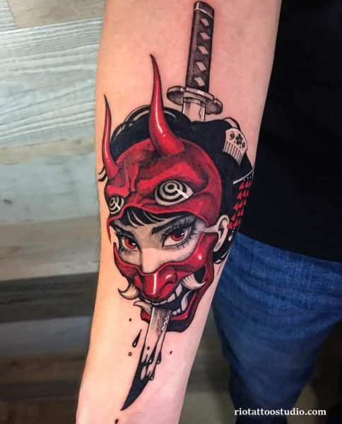 Oni mask tattoo red hannya katana sword piercing forearm, intense oni mask tattoo ideas