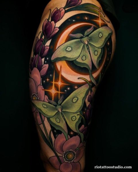 Large shoulder moth tattoo with purple flowers and glowing moon, dramatic moth tattoo ideas