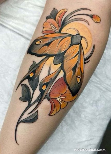 Colorful moth tattoo with orange flowers and sun on arm, vibrant moth tattoo ideas
