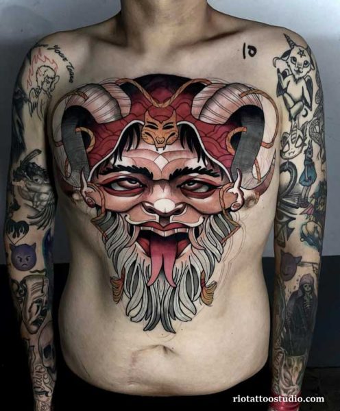 Neo traditional oni demon mask chest tattoo horns tongue red, bold neo traditional tattoo