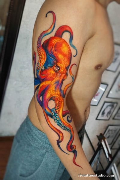 Octopus tattoo colorful rainbow orange blue purple arm, vibrant octopus tattoo ideas