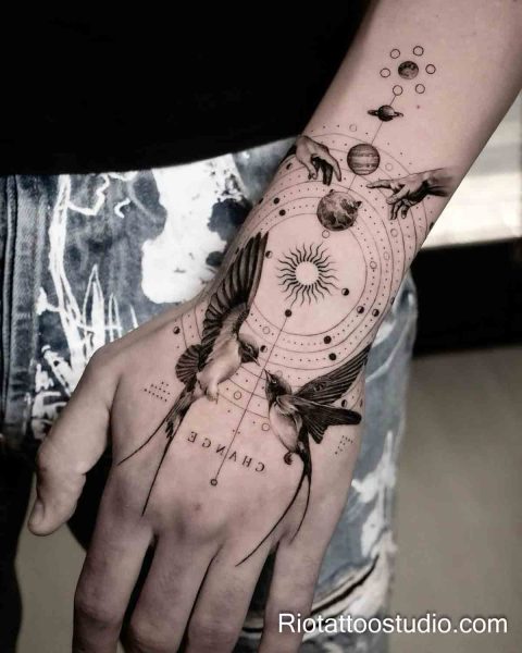 Patchwork forearm hand tattoo swallows Creation of Adam sun planets "CHANGE", meaningful patchwork tattoo