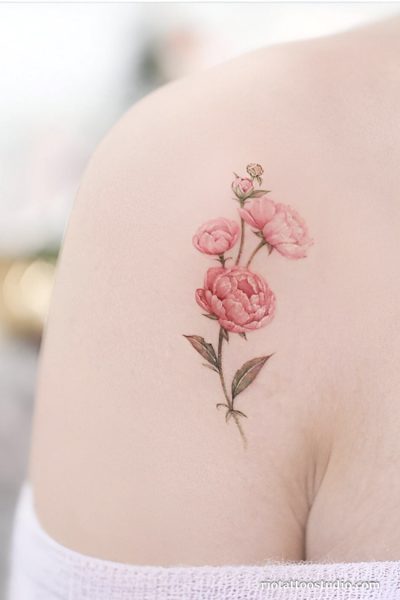 Small watercolor peony tattoo with three blooms on shoulder, delicate peony tattoo ideas