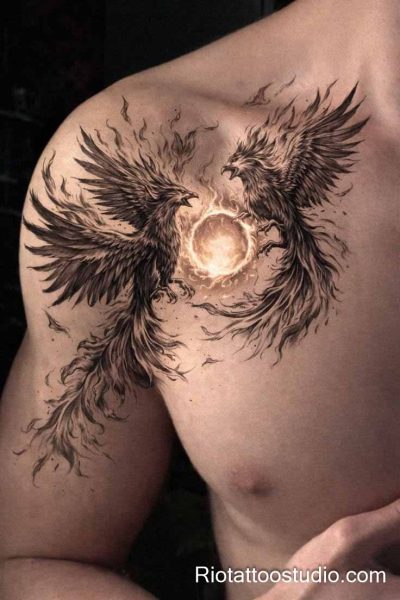 Phoenix tattoo dual birds glowing sun shoulder chest black grey, powerful phoenix tattoo ideas