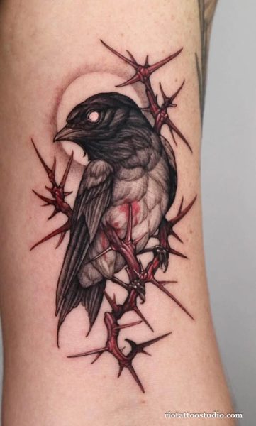 Minimalist Raven Tattoo with clean lines and simple silhouette at Rio Tattoo Studio.