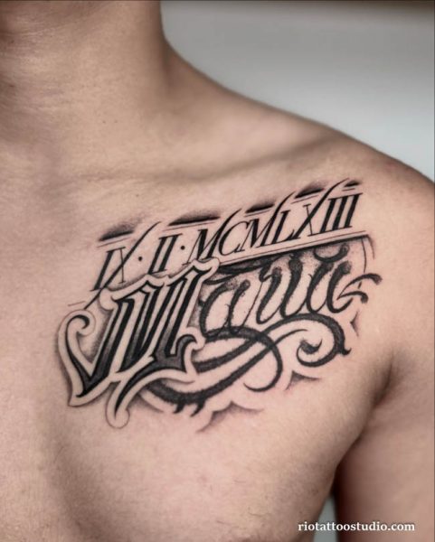 Ornate roman letter tattoo with gothic script on chest and shoulder, dramatic roman numeral tattoo ideas