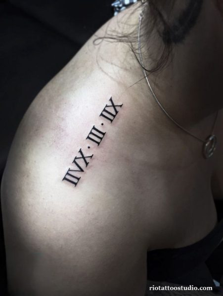 Roman numeral tattoo IVX.III.IV on shoulder and collarbone, classic roman letter tattoo ideas