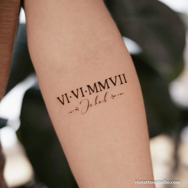 Minimalist roman numeral tattoo with name Jakob on inner arm, simple roman letter tattoo ideas